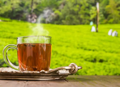 tea-glass-cup-wooden-table-tea-plantations-background_1500x